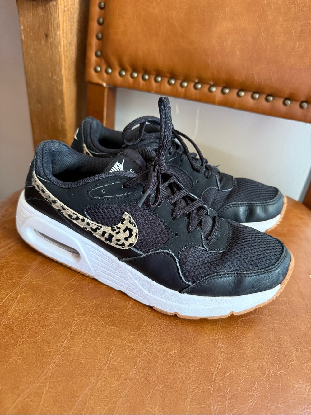 Nike Women's Black Sneakers with Leopard Swoosh